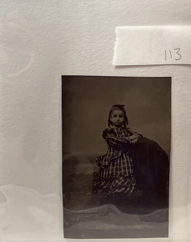 Untitled (Portrait of a Young Girl With Curled Hair Wearing a Plaid Dress, Standing)