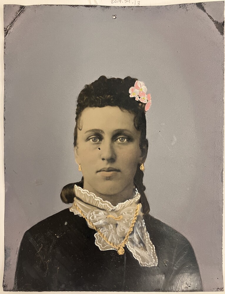 Untitled (Young woman with pink flower in hair)