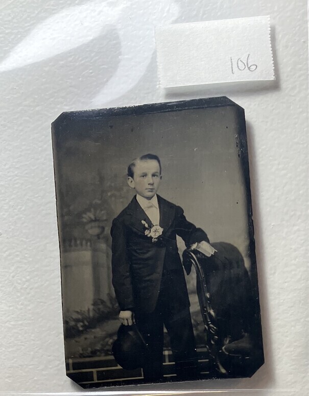 Untitled (Portrait of Young Boy Holding a Bowler Hat)