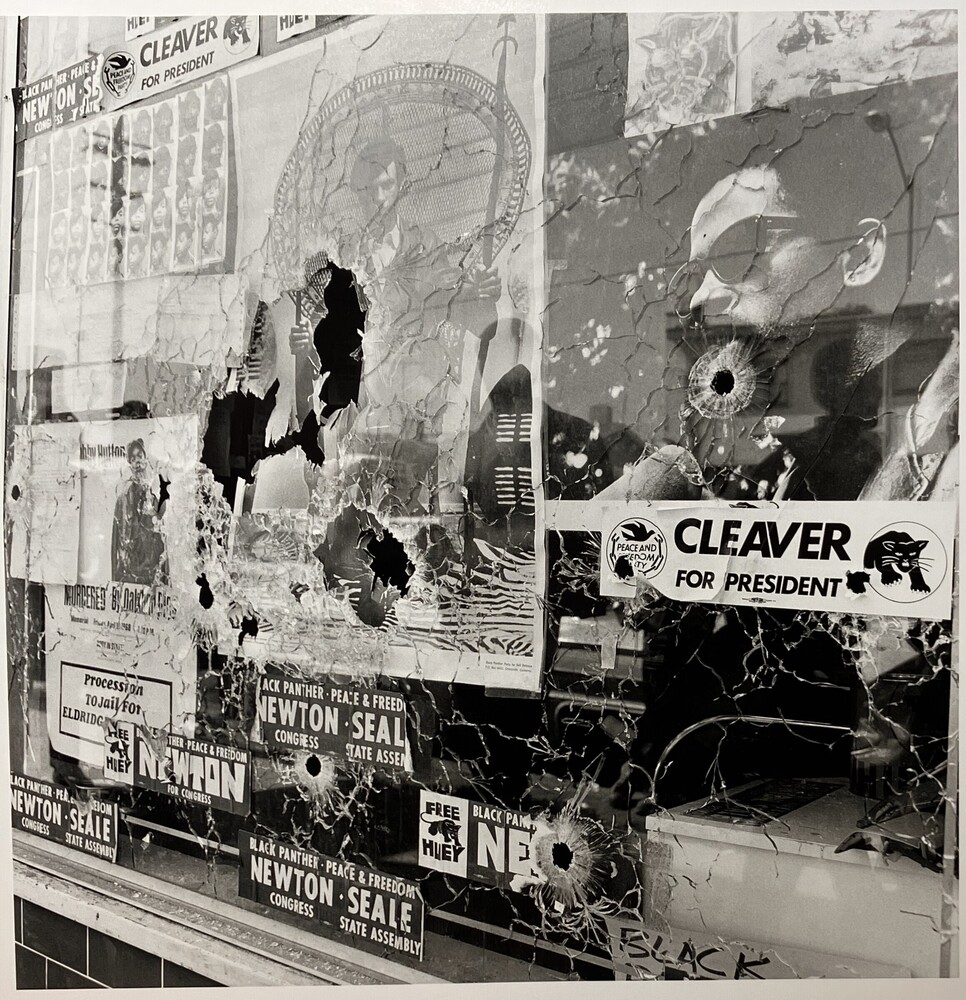 Photograph 1 of 2 titled Plate glass window of the Black Panther Party National Headquarters, the morning it was shattered by the bullets of two Oakland policemen, number 80 from the series A Photo Essay on the Black Panthers, Gelatin silver print, accession number 2012.35.23.