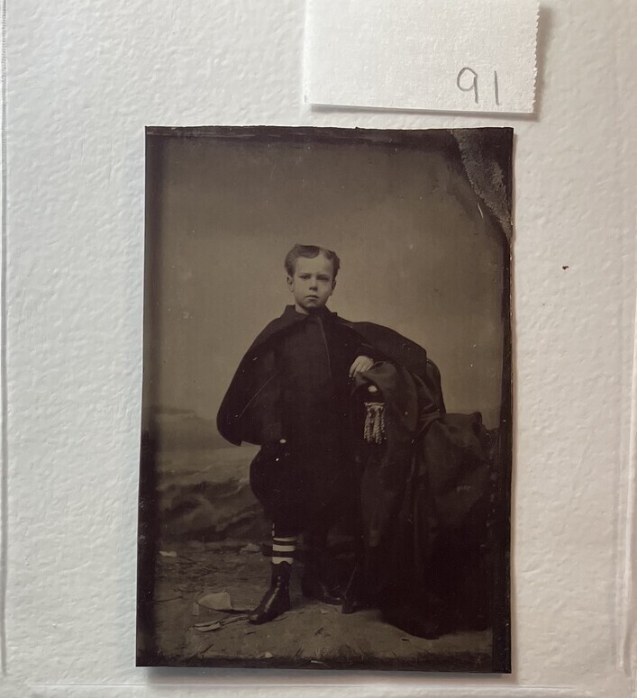 Untitled (Portrait of Young Boy with Striped Hosiery, Standing)