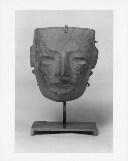 Sculpture titled Untitled (carved mask), stone, accession number 1991.10.14.