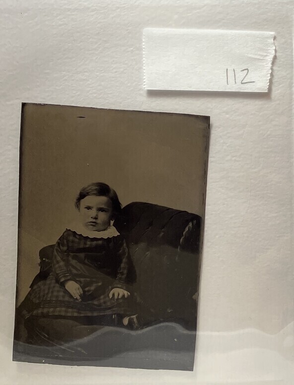 Untitled (Portrait of a Young Child Wearing a Plaid Dress and Lace Collar, Seated)