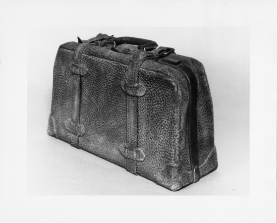 Sculpture titled Black Suitcase, ceramic, aluminum wire, accession number 1971.39.