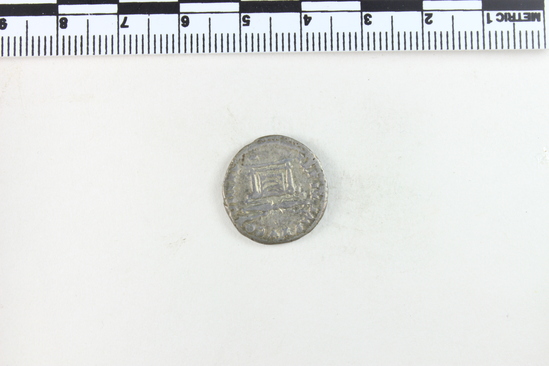 Hearst Museum object 3 of 8 titled Coin: denarius, accession number 8-5637, described as Coin. Roman. Denarius. (    gms.; 18 mm.) Titus, AD. 80, Rome. Obverse: IMP TITVS  CAES   VESPASIAN AVG  P M   Head facing right, laureate. Reverse: TR P IX   IMP XV  COS  VIII   P P   Winged thunderbolt on draped altar.