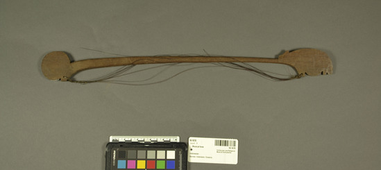 Hearst Museum object titled Musical bow, accession number 18-1678, described as Bow, musical; hardwood frame; fiber strings [frayed] and flat ends. Length 46.2 cm. For use with 18-1660-61. For use with 18-1660-61