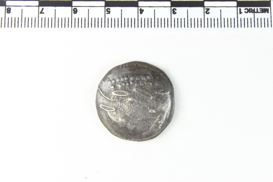 Hearst Museum object 4 of 6 titled Coin: ar tetradrachm (barbarous imitation), accession number 8-4488, described as Coin; AR; Tetradrachm; Greek. 13.63 grams, 25 mm. Obverse: traces of head l. laureate. Reverse: Horseman r. Remarks: "Barbarous imitation of Philip II