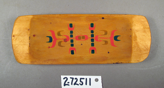 Hearst Museum object titled Rectangular bowl, accession number 2-72511, described as Wood serving tray, painted with brown, green, and red designs. Label with "A" affixed to backside of tray.