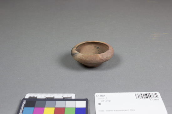 Hearst Museum object titled Oil lamp, accession number 9-11687, described as oil lamp, terracotta; round with incurved lip; rim diameter 6.2 cm