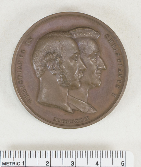 Hearst Museum object 1 of 4 titled Medal, accession number 7-2609, described as medal: AE, Christian I, Christian IX Universtiatas Hauniensis