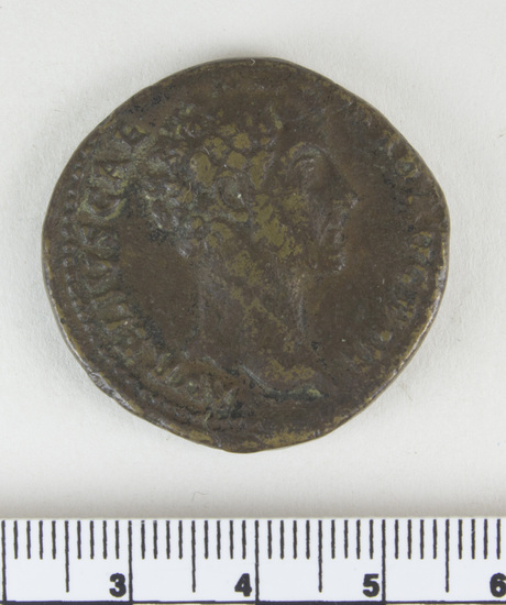 Hearst Museum object 8 of 14 titled Coin: æ sestertius, accession number 8-4887, described as Coin; AE; Sestertius; Roman. 22.80 grams, 32 mm. Marcus Aurelius, 148-149 AD. Rome, Italy. Obverse: AVRELIVS CAESAR AVG PII F, bust r. bare. Revere: TR POT III COS II, Pietas standing l., hand on head of small girl l.; in field, S C; in exergue, PIETAS. Remarks: Date is unlikely, falls during reign of Antoninus Pius.