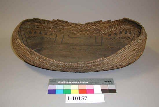 Hearst Museum object titled Canoe shaped basket, accession number 1-10157, described as Basket; Warp is Willow (Salix), weft is Redbud (Cercis occidentalis). Black pattern is Brake fern (Pteris quilina). Boat-shaped.  Decoration: black geometrical figures. Design material is brackenfern root. Upper portion is single-rod coiling with interlocking stitches; lower portion is coiling on a multiple rod foundation with split stitches. Lower part of basket is designed, upper part is not.