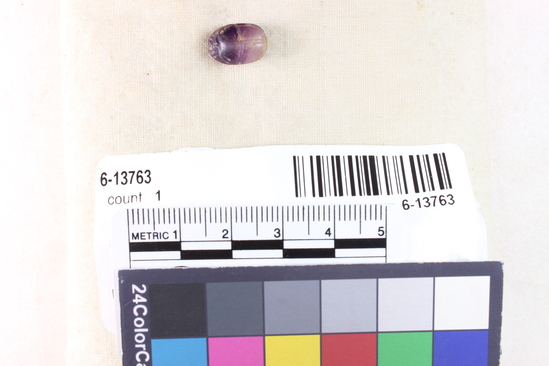 Hearst Museum object 4 of 8 titled Scarab, accession number 6-13763, described as Amethyst scarab, uninscribed. Length 12.2 mm, width 8.3 mm, height 5.9 mm.