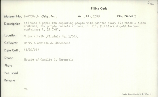 Documentation associated with Hearst Museum object titled Fan, accession number 9-6768a,b, described as (a) Wood and paper fan depicting people painted ivory (?) face and cloth costume; light purple tassels at base; length 11 inches; (b) black and gold lacquer contain; length 12 7/8 inches.