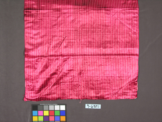 Hearst Museum object titled Textile, accession number 9-6891, described as Sari fabric, warpface; rayon warp; cotton weft; red and pink stripes; “mushroo;” 37 by 109”