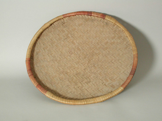 Hearst Museum object titled Tray, accession number 5-10268, described as tray;  shallow basket;  plain;  twill-plaited;  over 2 under 2;  wrapped hoop rim;  red and yellow on rim;  diam. 41 cm.