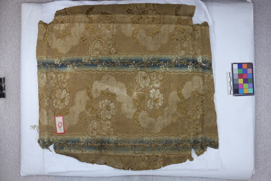 Hearst Museum object 35 of 49 titled Icon, accession number 7-3541, described as Icon of “Our lady of Vladmir”; Virgin and Child in tempera and gesso on wood; gilded silver basma; cloisonne halo with cloisonne collar pendant; halo has glass and amber (?) ornamentation; Virgin’s face damaged; height 30.2 cm, width 26 cm.