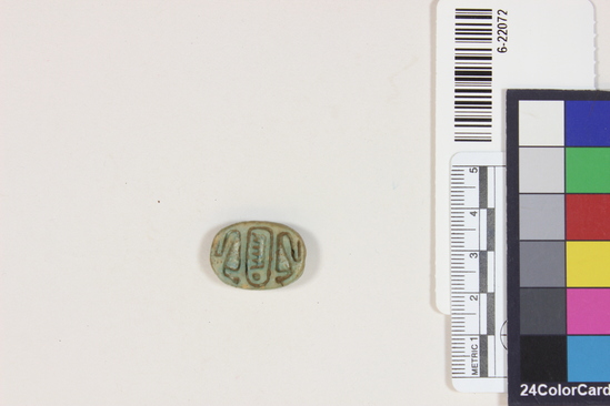 Hearst Museum object titled Seal, accession number 6-22072, described as flat, ovular seal, with Udat and two Uraeus; length 23 mm