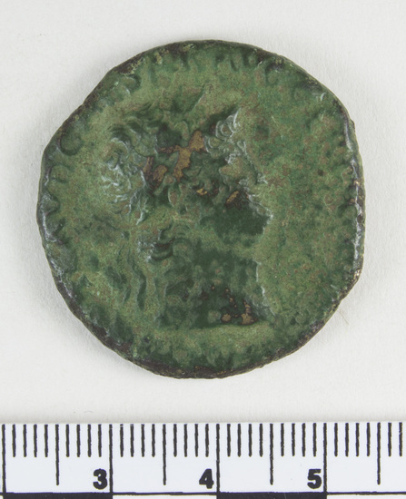 Hearst Museum object 6 of 8 titled Coin: æ sestertius, accession number 8-6453, described as Coin: Sestertius; Æ; Nero Ru, Roma, 20.3 gm. Obverse: ...CLAVD CAESAR AVGGER... - Radiate head of Nero, facing right. Reverse: RO... in exergue Roma (?) seated facing left.