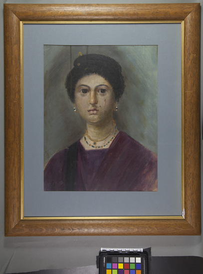 Hearst Museum object titled Mummy portrait (reproduction), accession number 5-373, described as Copy of Greek mummy portrait from the Fayum Egypt Original painted in the 3rd century Originals discovered by Flinders Petrie are in National Gallery London. Painted in wax colors applied with brush to cestrum. Copies by Eleanor Harrison Supplee