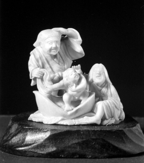 Hearst Museum object titled Netsuke, accession number 9-7532, described as Carving: old man standing, old woman seated, small baby.