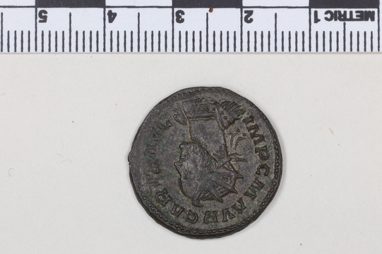 Hearst Museum object 8 of 10 titled Coin: billon antoninianus, accession number 8-4388, described as Coin; Billon; Antoninianus; Roman. 4.76 grams, 23 mm. Carus, 282-285 AD. Lyon, France. Obverse: IMP C M AVR CARVS AVG, bust r. radiate, cuirassed. Reverse: VICTORIA AVGG, Victory l. on globe between two captives; to l., A.