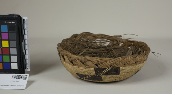 Hearst Museum object 2 of 2 titled Cap, accession number 1-1586, described as Basketry cap; twined. Warp is Hazel (Corylus cornuta californica), weft is Conifer root (Pinophyta). White pattern is Beargrass (Xerophyllum tenax). Black dye is Maidenhair fern (Adiantum pedatum). Unfinished.