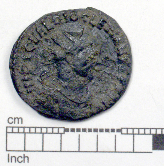 Hearst Museum object 1 of 8 titled Coin: æ antoninianus, accession number 8-6019, described as Coin: Antoninianus; Æ; Diocletian - 3.71 grams. Obverse: IMP C C VAL DIOCLETIANVS AVG - Bust facing right radiate, cuirassed. Reverse: VIRTVS AVG - Soldier standing facing left, right hand on shield, left holding spear [untranscribable symbols].