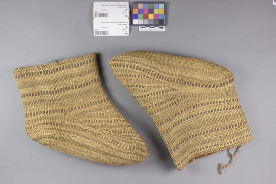 Hearst Museum object titled Socks, accession number 2-94a,b, described as Pair of woven grass, different colors of grasses (green, straw and red) used alternately to produce overall pattern of parallel lines.