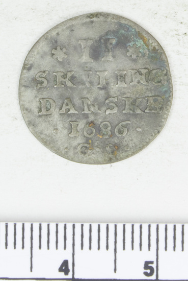 Hearst Museum object titled Coin, accession number 7-2939, described as Coin: AG; Obverse- (Cipher of Christian V) Reverse- 11 skilling Danske. 1686; 1.00 grams.