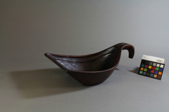 Hearst Museum object titled Dish, accession number 2-4677, described as Grease dish in shape of canoe bailer; carved wood; incised diagonal lines on handle at base.