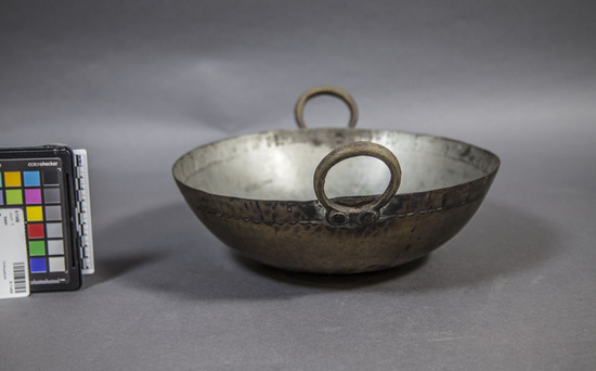 Hearst Museum object titled Pan, accession number 9-11456, described as Basin (frying pan) with rounded bottom, two large handles extending above top edge; brass. Width 29 cm x height 9.2 cm. Role in trade - made in Maradabad, c. 1939