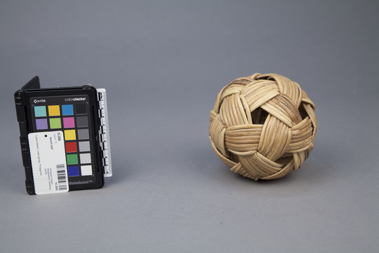 Hearst Museum object 1 of 2 titled Woven ball, accession number 10-2886, described as Ball; rattan; hexagonal plaiting; 12.8 centimeter diameter