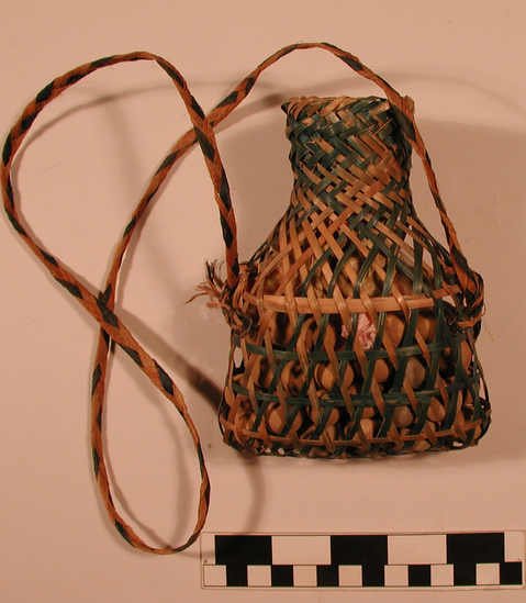 Hearst Museum object titled Basketry bag, accession number 9-13181, described as Basket; small bottle-shaped; plaited split bamboo; strap, containing clay marbles