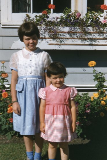 Hearst Museum object titled Color slide, accession number 25-19535, described as Two girls- one older than the other- standing on lawn