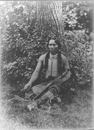 Hearst Museum object titled Photograph, accession number 13-97, described as Omaha man wearing traditional costume and hairstyle.