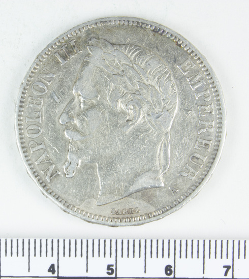 Hearst Museum object titled Coin, accession number 7-3801, described as Coin; Ag; 5 francs; Obverse- Head of Napoleon III; Reverse- Crest of Empire; 1870