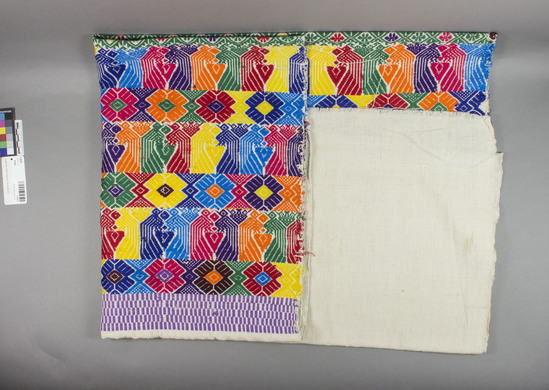 Hearst Museum object titled Textile, accession number 3-30227, described as RGM yardage, 36 inches width and 66-1/2 inches long; wide band of natural white at each end, then horizontal bands of multicolored women patterns which reverse at the middle (like a table runner), bands start with purple and white bars, then bands of multicolored flowers and multicolored birds which repeat several times to the middle; middle band is green with flowers.