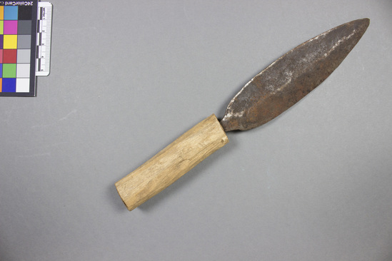 Hearst Museum object titled Knife, accession number 5-15444, described as Knife: iron, palmate shaped blade, sharpened on both edges; cylindrical wood handle. Used for cutting meat and vegetables. Length (overall) 23.0 cm. Width (blade) 3.5 cm.