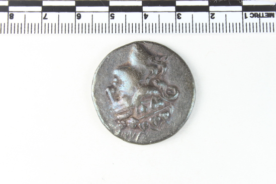 Hearst Museum object 2 of 6 titled Coin: ar tetradrachm, accession number 8-7576, described as Coin: Tetradrachma, Silver, size: 31 mm., weight: 16.84 g., condition: Ex. Obverse: Head of Dionysos wreathed with wine leaves. Reverse: Standing Herakles (Farnese type) with lion’s skin and club. Inscription: HΡΑΚΛEΟΥΣ ΣΩΤHΡΟΣ ΘΑΙΩΝ. Herakles Soteros (Savior), in exerge: Thasos (Thrace).