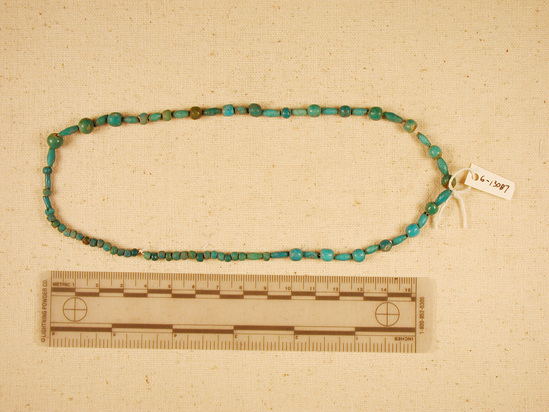 Hearst Museum object titled Beads, accession number 6-13087, described as beads: string blue glaze barrel-shaped and spherical; length 38 cm