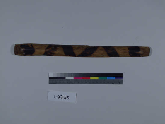 Hearst Museum object titled Gambling stave, accession number 1-2755, described as Wood, half - round, charred decoration on round surface. Polished from usage. One of set 1-2750-56