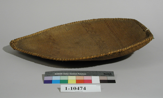 Hearst Museum object 1 of 2 titled Winnower, accession number 1-10474, described as Winnower basket; warp and weft are Redbud (Cercis occidentalis). Red pattern is Redbud. Finely woven flat triangular sifting basket. Decorated with red lines and triangles.