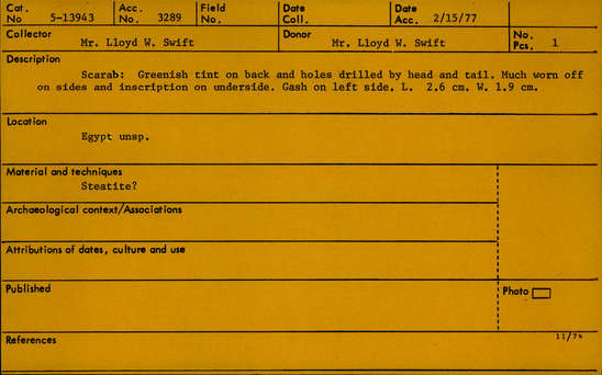 Documentation associated with Hearst Museum object titled Scarab, accession number 5-13943, described as Scarab: Greenish tint on back and holes drilled by head and tail. Much worn off on sides and inscription on underside. Gash on left side.