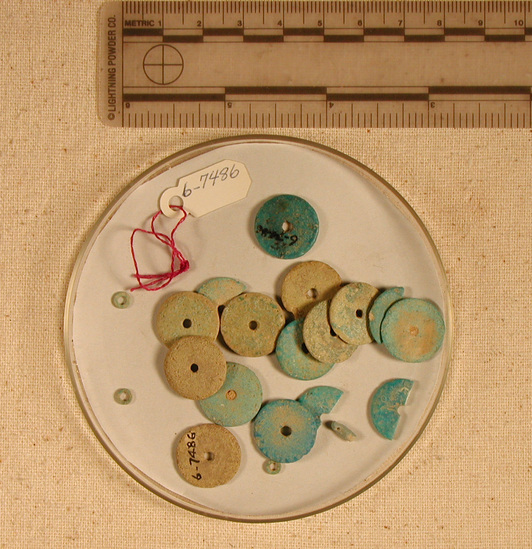 Hearst Museum object titled Beads, accession number 6-7486, described as beads: 14 large faience discs. 4 small faience discs. 1 carved faience disc.