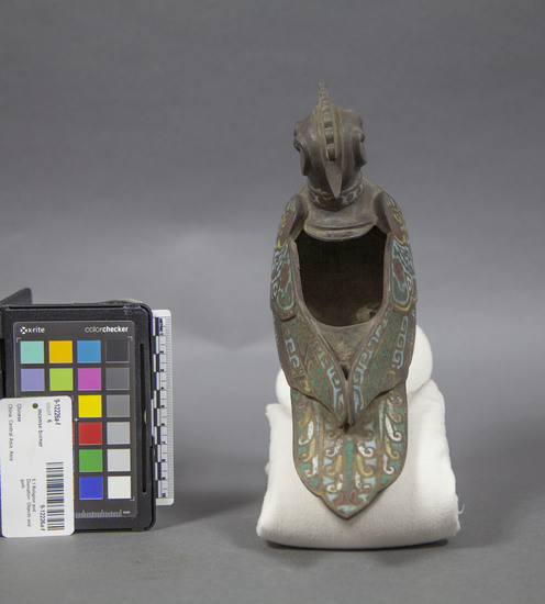 Hearst Museum object titled Incense burner, accession number 9-12226a-f, described as Three phoenixes on stand, cast bronze and cloisonne. A) 3-lobed stand, edge has openwork design with stylized floral motif, 1 phoenix soldered in place, width 37.5 cm, height 31.5 cm; B) wing, bronze, and cloisonne, length 14.4 cm; C) bronze and cloisonne  phoenix, beak to tail length 29.7 cm; D) wing, bronze and cloisonne, length 14.6 cm; E) bronze and cloisonne phoenix, beak to tail length 24.3 cm; F) lid, bronze, length 8.2 cm