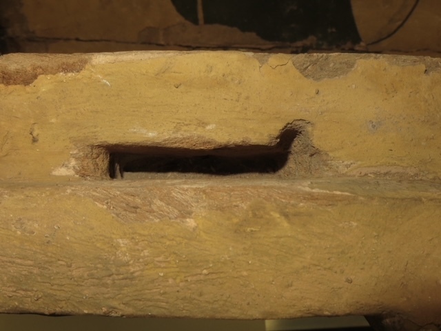 Hearst Museum object 121 of 167 titled Coffin, accession number 6-19912, described as Wooden anthropoid coffin. Inscription running down center of lid. Determined by Kea Johnston to probably be the outer coffin of Iwefaa (6-19928, 12-11039). According to Kea Johnston, "This coffin belonged to a man named Iwefaa, whose name is inserted in the middle of the spells written in the two columns on the front. This coffin is likely the outer coffin for PAHMA 6-19928 based on the similarity of the owner's name, unusual costume, and the paleography of the inscription. Both coffins were purchased on the antiquities market by George Reisner for Phoebe A Hearst. However, stylistically, they are very similar to a set of coffins known to have come from the site of Akhmim, which was excavated in the 1880s by Gaston Maspero, and which has heavily looted for the antiquities market during this decade." "The pectoral vignette between the text and the collar shows the deceased standing before squatting baboon and is the source of our logo. The hieroglyph for 'sky' is above their heads, and the side borders are formed by a pyramid and the symbol for the West.