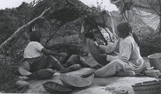 Hearst Museum object 2 of 2 titled Black-and-white negative, accession number 15-20953, described as Three Mono women processing acorn meal, backs to camera