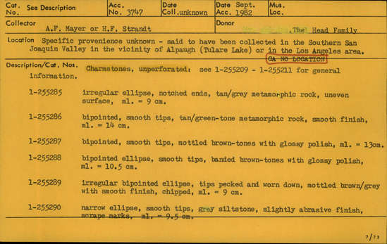 Documentation associated with Hearst Museum object titled Charmstone, accession number 1-255285, described as Unperforated charmstone; irregular ellipse, notched ends, tan/grey metamorphic rock, uneven surface