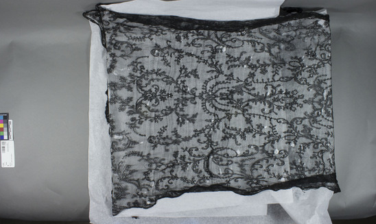 Hearst Museum object titled Shawl, accession number 3-11064, described as Black lace shawl, floral patterned.